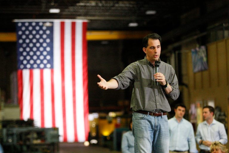 Wisconsin Gov. Scott Walker addresses a crowd at Giese Manufacturing, Sunday, in Dubuque, Iowa. (Mike Burley/Telegraph Herald via AP)
