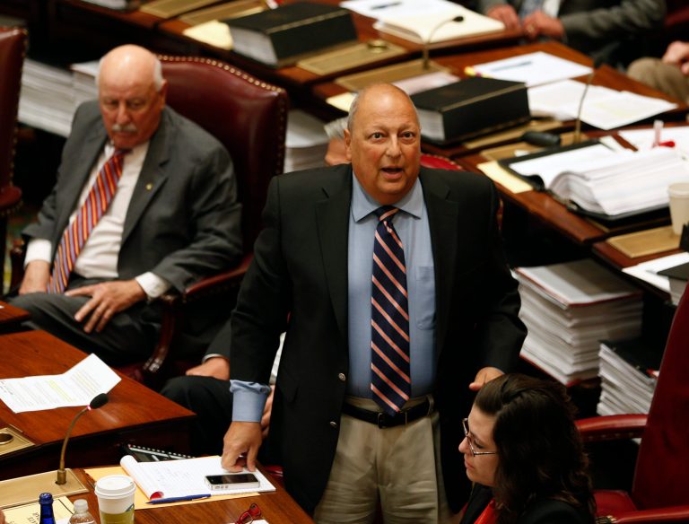 FILE - In this Friday, June 20, 2014 file photo, Sen. Thomas Libous, R-Binghamton, debates medical marijuana legislation in the Senate Chamber at the Capitol in Albany, N.Y. In an indictment unsealed Tuesday, July 1, 2014, the top-ranking New York state senator has pleaded not guilty to a charge that he lied to the FBI about arranging a law firm job for his son. (AP Photo/Mike Groll)