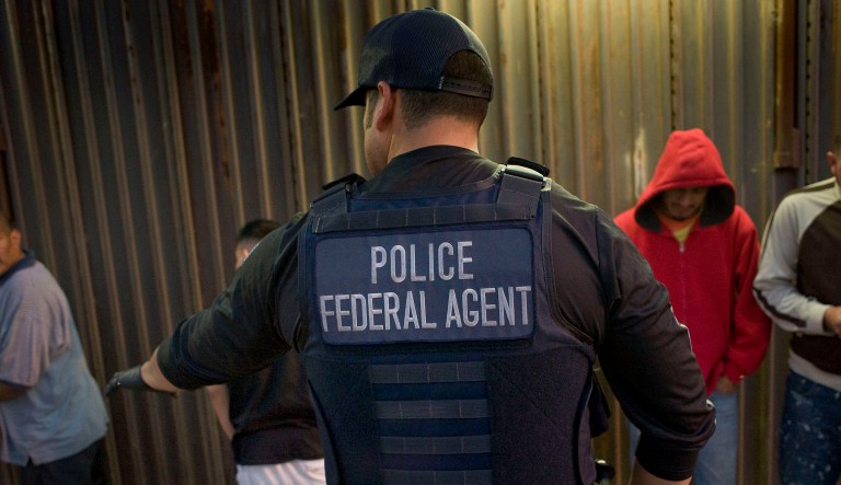 An Immigration and Customs Enforcement agent directs a group of undocumented men being deported to Mexico at the U.S.-Mexico border. The number of criminal and noncriminal illegal immigrants deported by U.S. Immigration and Customs Enforcement from Oct. 1 through Dec. 31, 2017, was about 17 percent lower than the number the agency removed during the same period a year earlier. (David Maung/Bloomberg)
