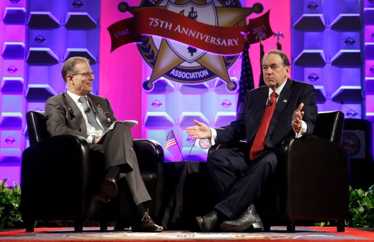 Republican presidential candidate, former Arkansas Gov. Mike Huckabee, right, speaks at the National Sheriffs' Association presidential forum alongside Jonathan Thompson, the association's executive director and CEO, Monday, June 29, 2015, in Baltimore. (AP Photo/Patrick Semansky)