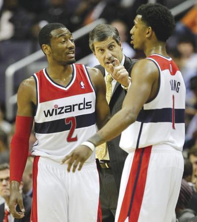 Rob Carr/Getty ImagesThe Wizards'John Wall, left, is averaging 16.8 points and 7.6 assists a game, while Nick Young is averaging 17.2 points a game.