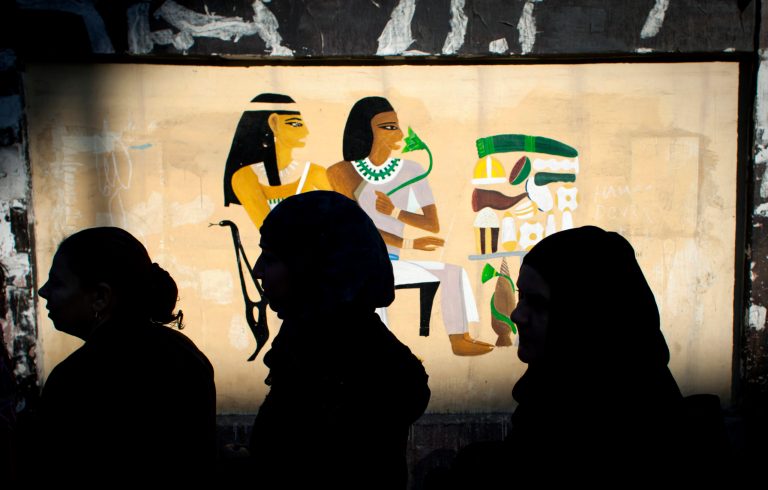   Egyptian women voters queue outside a polling station during the second round of a referendum on a disputed constitution drafted by Islamist supporters of president Mohammed Morsi, in Giza, Egypt, Saturday, Dec. 22, 2012. (AP Photo/Nasser Nasser)  