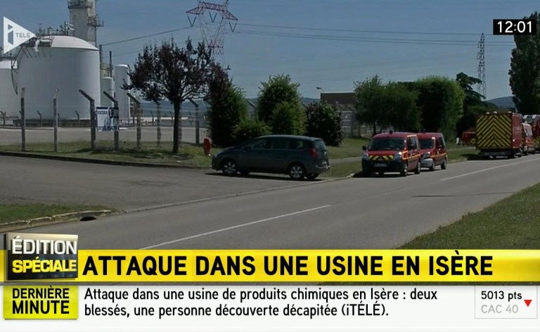 In this screen grab taken from video provided by I Tele, emergency services at the scene outside a factory where a man was allegedly beheaded, in Saint-Quentin-Fallavier, France, Friday, June 26, 2015. French authorities have opened an investigation after an attack and explosion at a gas factory that left one person decapitated and several wounded. Banners with Arabic inscriptions were found near the body, an official said. (I Tele via AP)