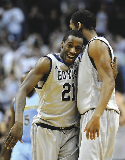 Richard Lipski/AP
Jason Clark, left, finished with 26 points and Hollis Thompson hit the tiebreaking 3 as Georgetown rallied past Marquette.