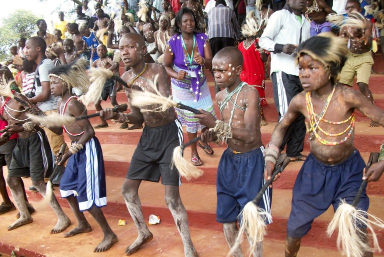 In this photo taken Saturday, Aug. 9, 2014, boys from the Bukusu ethnic group, which prefers traditional circumcision using simple tools and no anesthesia, attend a circumcision ceremony in Bungoma, western Kenya. While the circumcision season among Kenya's Bukusu ethnic group brings a festive atmosphere, at least 12 men from other tribes have been forcibly circumcised since the start of the circumcisions in August 2014, according to police and local authorities, and a group of men from the Turkana tribe wielding swords, bows and clubs held protests last week over the spate of forced procedures. (AP Photo)