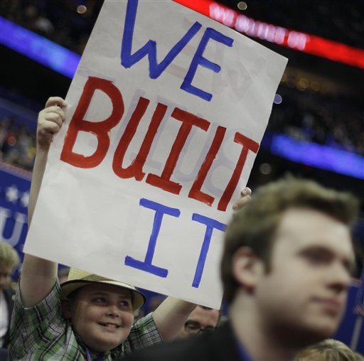 Nathanael Harris from Springdale, Ark., holds up a sign during the Republican National Convention. (AP Photo)