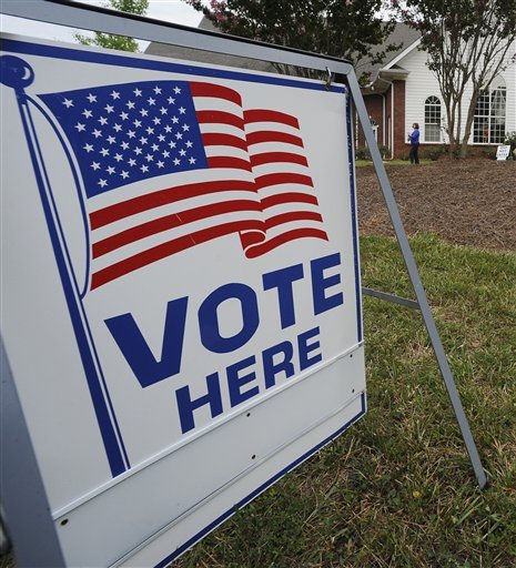 A voter departs a the polls in. Georgia. (AP Photo)
