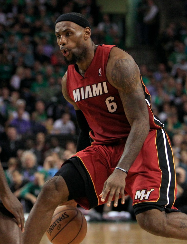   In this photo taken Thursday, June 7, 2012, Miami Heat forward LeBron James works the ball against the Boston Celtics during the fourth quarter of Game 6 in their NBA basketball Eastern Conference finals playoff series in Boston. James scored 45 points to lead Miami to a 98-79 win. Game 7 is scheduled for Saturday night in Miami. (AP Photo/Elise Amendola)  