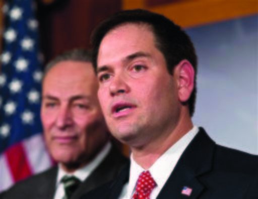 Sen. Marco Rubio, R-Fla., right, and Sen. Charles Schumer, D-N.Y., left, joined a bipartisan group of leading senators to reform immigration. A new poll finds Rubio winning a majority of the Hispanic vote in a 2016 presidential race.  (AP Photo/J. Scott Applewhite)