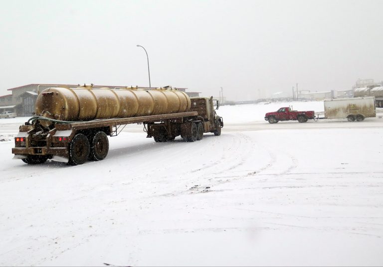 A truck servicing the oil field turns into traffic in snowy Williston, N.D. (AP/Josh Wood)
