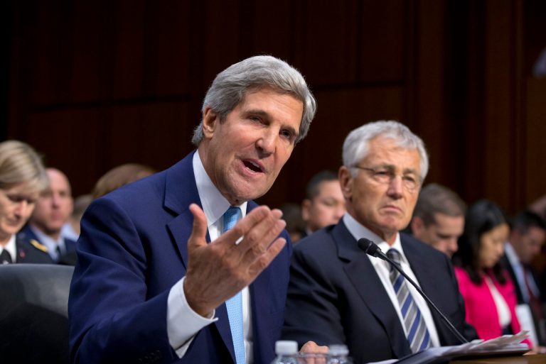 Secretary of State John Kerry, left, and Defense Secretary Chuck Hagel, right, appear before the Senate Foreign Relations Committee to advance President Barack Obama's request for congressional authorization for military intervention in Syria. (AP/J. Scott Applewhite)