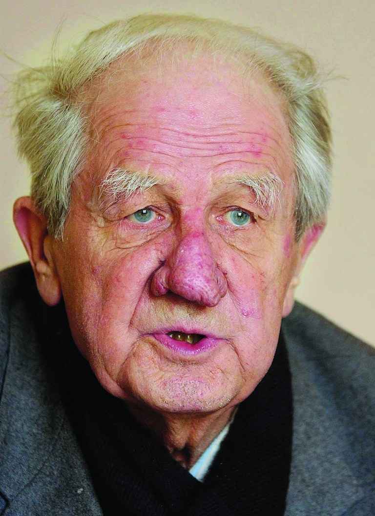 FILE - In this Jan. 31, 2006 photo Wilhelm Brasse speaks during an interview with The Associated Press in Zywiec, Poland. Brasse, a former Auschwitz prisoner who survived the camp after the Nazis discovered he was a professional photographer and put him to work taking pictures of other prisoners, has died. He was 95. Brasse was a political prisoner for five years in the Nazi run death camp during World War II, where he took prisoner identity photos and later pictures of SS doctor Josef Mengele's 