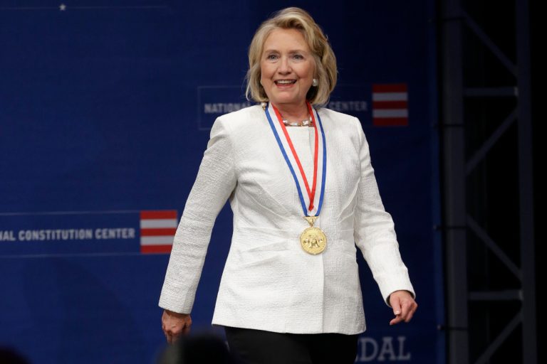 Former Secretary of State Hillary Rodham Clinton walks to the podium after receiving the Liberty Medal during a ceremony at the National Constitution Center, Tuesday, Sept. 10, in Philadelphia. The honor is given annually to an individual who displays courage and conviction while striving to secure liberty for people worldwide. (AP/Matt Rourke)