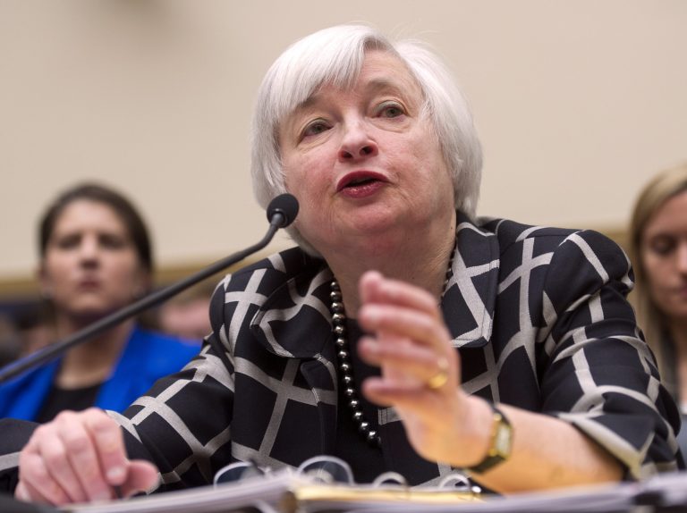 Federal Reserve Chair Janet Yellen testifies on Capitol Hill in Washington, Tuesday, Feb. 11, 2014, before the House Financial Services Committee hearing. Yellen said Tuesday that if the economy keeps improving, the Fed will take 