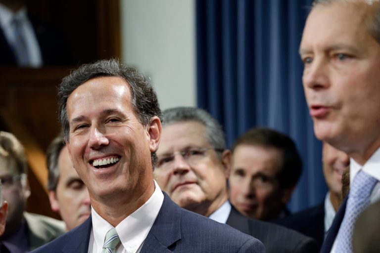 Former Pennsylvania Sen. Rick Santorum, left, listens to Texas Lt. Governor David Dewhurst, right, during a news conference outside the Texas state Senate chambers July 11 in Austin. (AP Photo/Eric Gay)