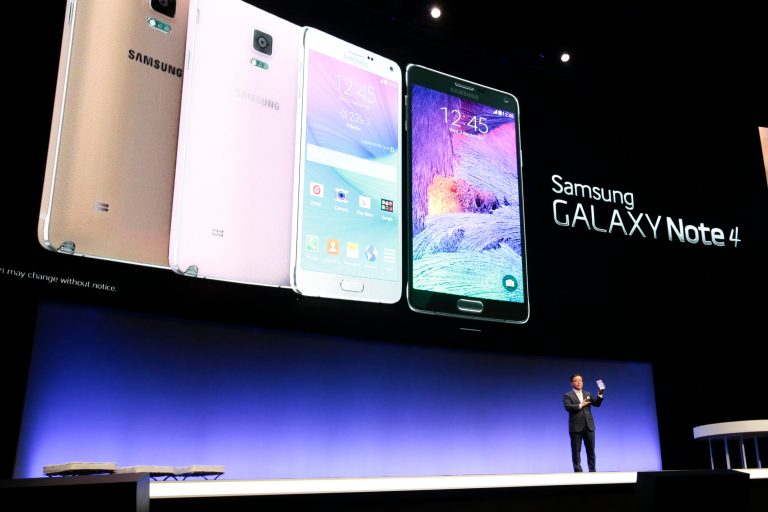 DJ Lee, Executive Vice President of Samsung,  presents a Samsung Galaxy Note 4 during his keynote at an unpacked event of Samsung ahead oh the consumer electronic fair IFA in Berlin, Wednesday, Sept. 3, 2014. (AP Photo/Markus Schreiber)