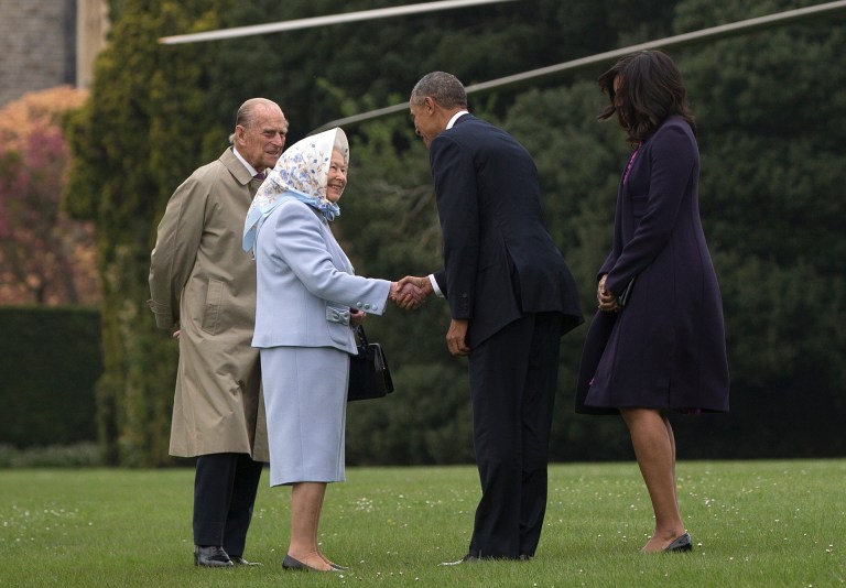 President Barack Obama and first lady Michelle Obama are greeted by Queen Elizabeth II and Prince Philip as they arrive on Marine One at Windsor Castle in Windsor, England, Friday, April 22, 2016. Obama is spending his first full day in the United Kingdom on Friday after arriving Thursday evening. He started by having lunch at Windsor Castle with Queen Elizabeth II, who celebrates her 90th birthday this week. (AP Photo/Carolyn Kaster)
