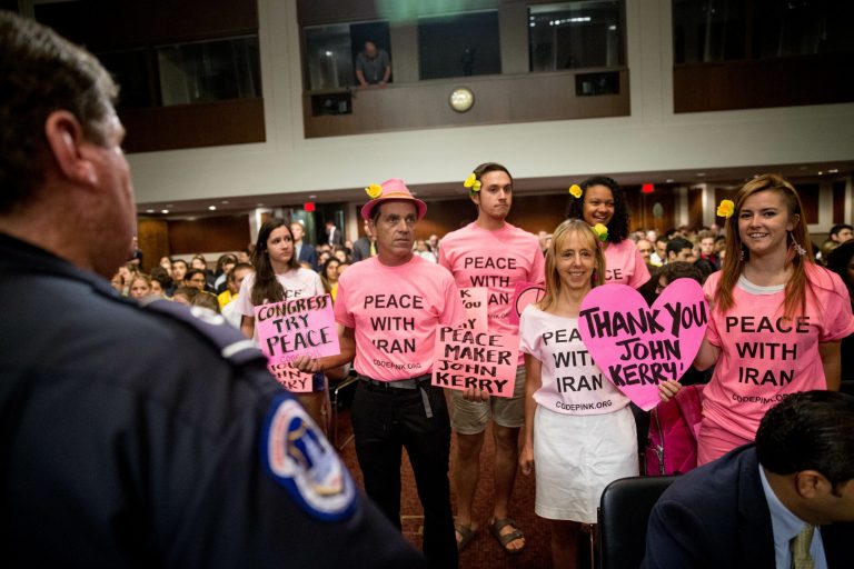 Members of the anti-war group Code Pink gather before Secretary of State John Kerry arrives to testify at a Senate Foreign Relations Committee hearing. (AP Photo/Andrew Harnik)