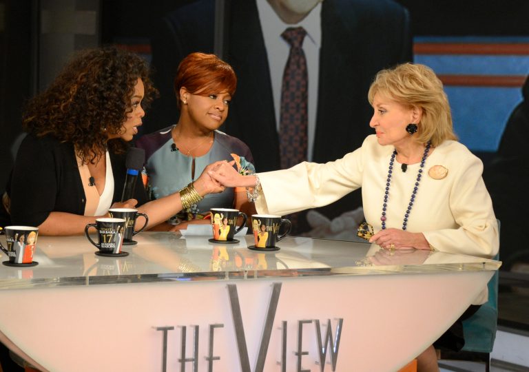 Oprah Winfrey, left, grasps hands with Barbara Walters, right, as co-host Sherri Shepherd looks on during a taping of Walters' final co-host appearance on 
