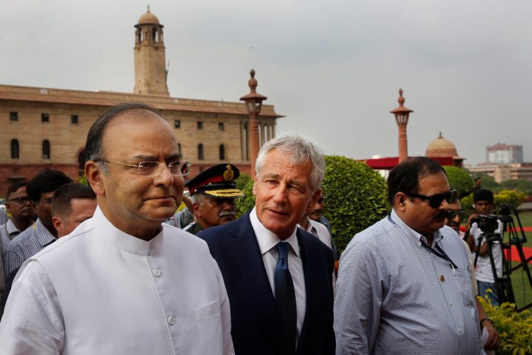 U.S. Defense Secretary Chuck Hagel, center, talks with Indian Defense Minister Arun Jaitley as they walk for a meeting in New Delhi, India, Friday, Aug. 8, 2014. Hagel is on a three day official visit to India. (AP Photo /Manish Swarup)