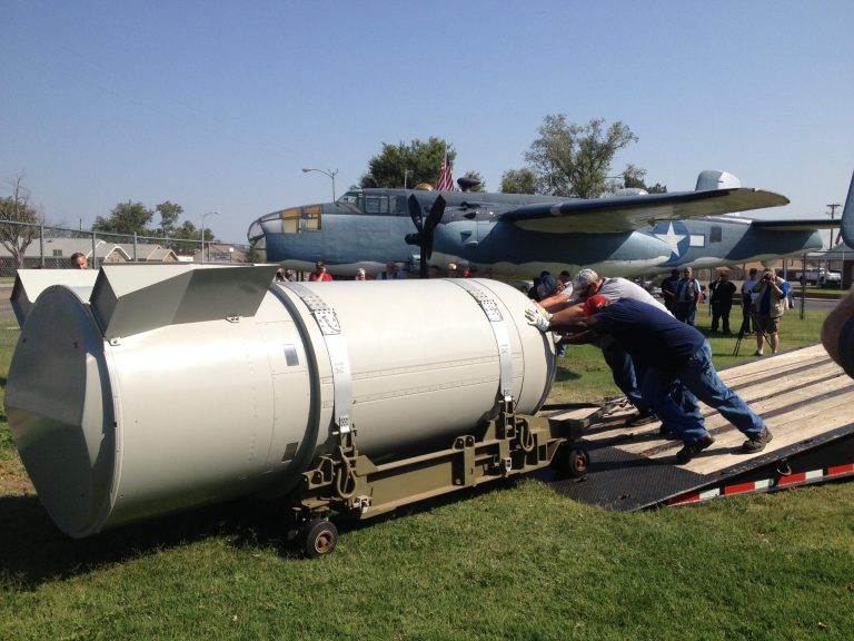 In this photo taken on Wednesday, July 23, 2014, workers push an empty B53 nuclear bomb casing to its new home at the Freedom Museum USA in Pampa, Texas. Museum board president John Triplehorn says the item portrays U.S. history and the role played by the military. The former bomb is on loan to the museum for two years. (AP Photo/The Amarillo Globe News, Jim McBride)