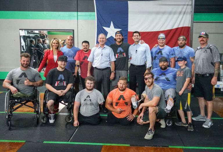 In the center, Adaptive Training Foundation founder David Vobora between former President George W. Bush and House Speaker Paul Ryan during their visit to cheer on wounded warriors. Photo/Political Office of Speaker Ryan