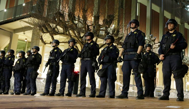 After protests broke out, University of California, Berkeley police were called to guard the building where then-Breitbart News editor Milo Yiannopoulos was to speak last September. (AP Photo/Ben Margot, File)