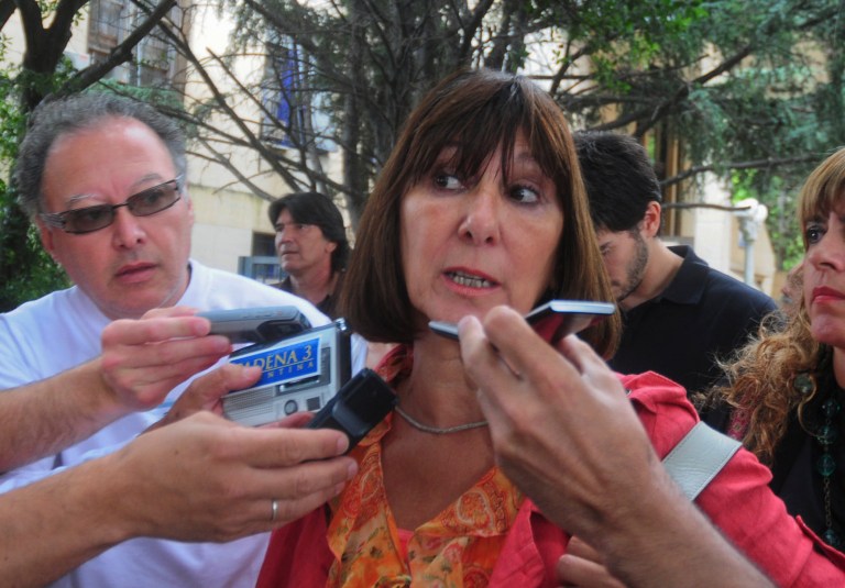   Felisa Miceli, former Argentine economy minister, talks to reporters outside the court house in Buenos Aires, Argentina, Thursday, Dec. 27, 2012, after being sentenced to four years in prison for corruption. Miceli was forced to quit in 2007 when Argentine pesos and U.S. dollars worth the combined equivalent of $52,000 were found in her office bathroom. The unanimous ruling said Miceli was guilty of the 