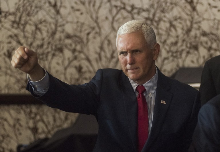 "It is extraordinary to think that yesterday in Philadelphia, 61 speakers came to the podium and not one of them named ISIS by name," Mike Pence said. (Ty Wright/Bloomberg)