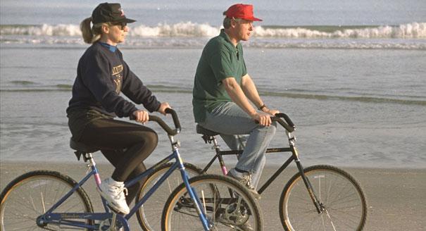Bill and Hillary Clinton bike on Hilton Head Beach in South Carolina in 2012. AP Photo