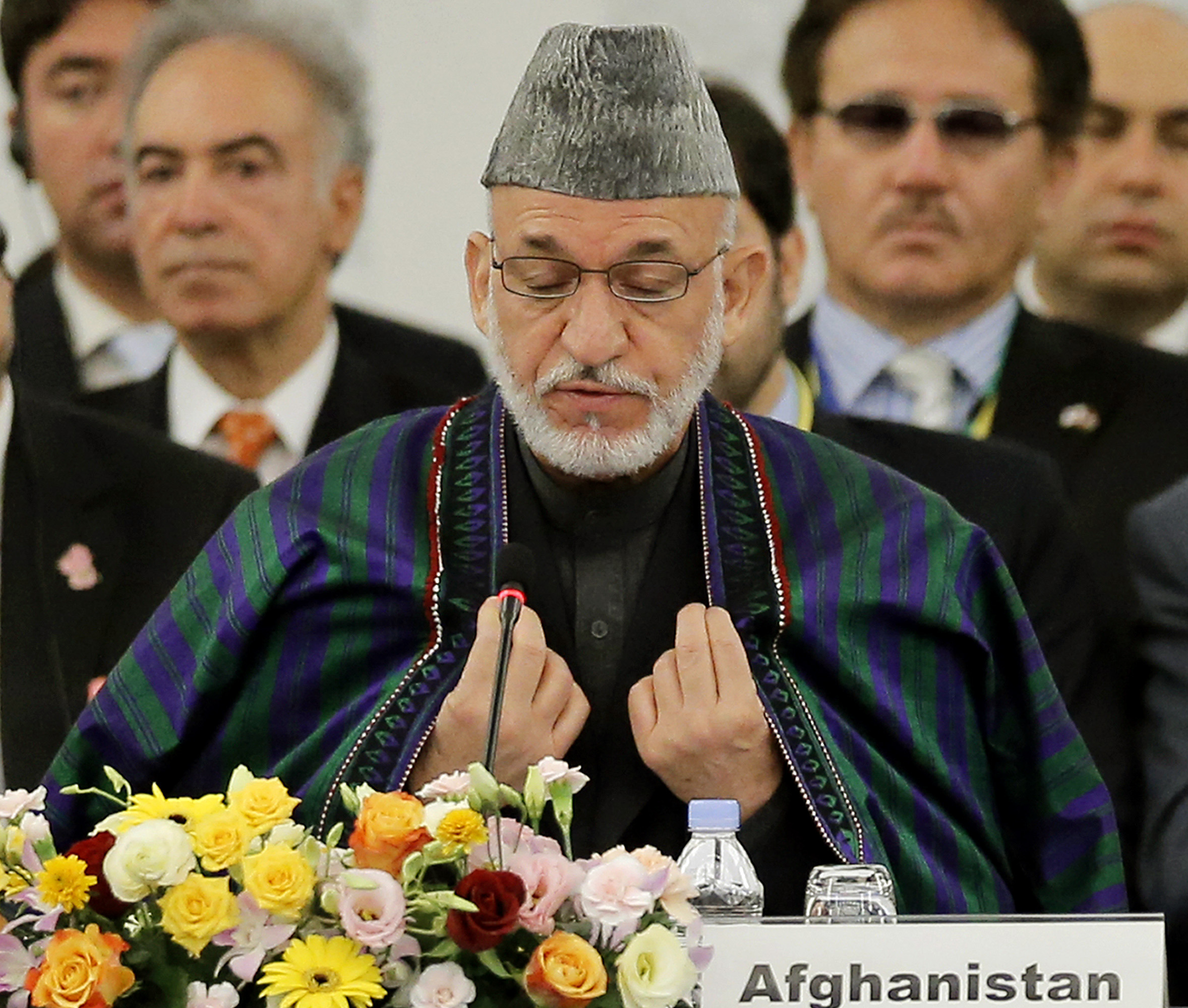 Karzai  condemns execution, but has spotty record on women’s rights
