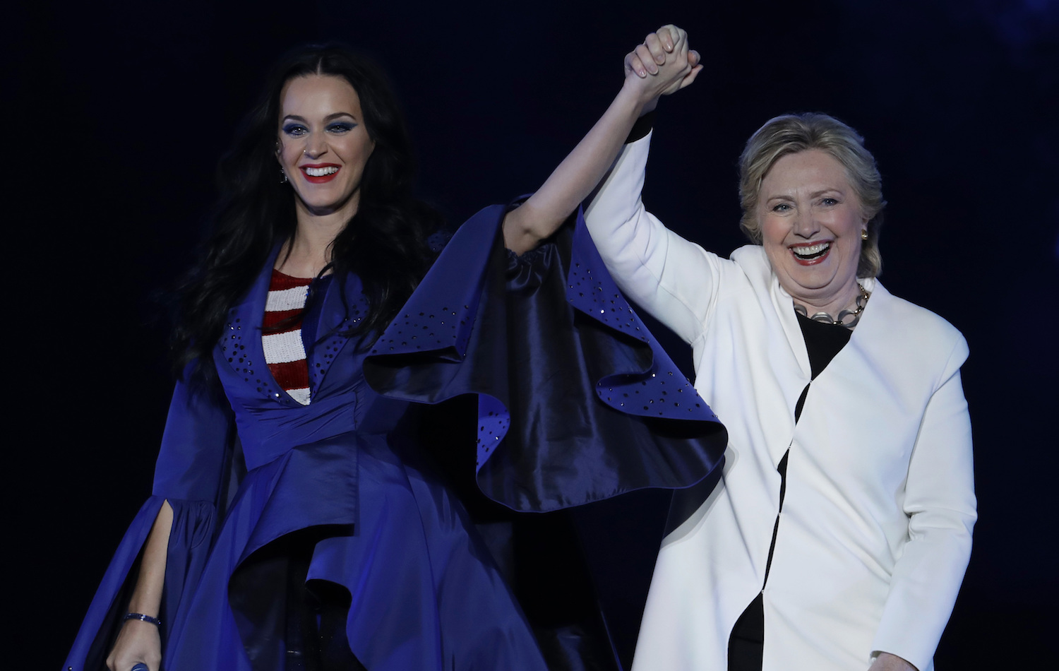 Hillary Clinton models shoes designed by Katy Perry