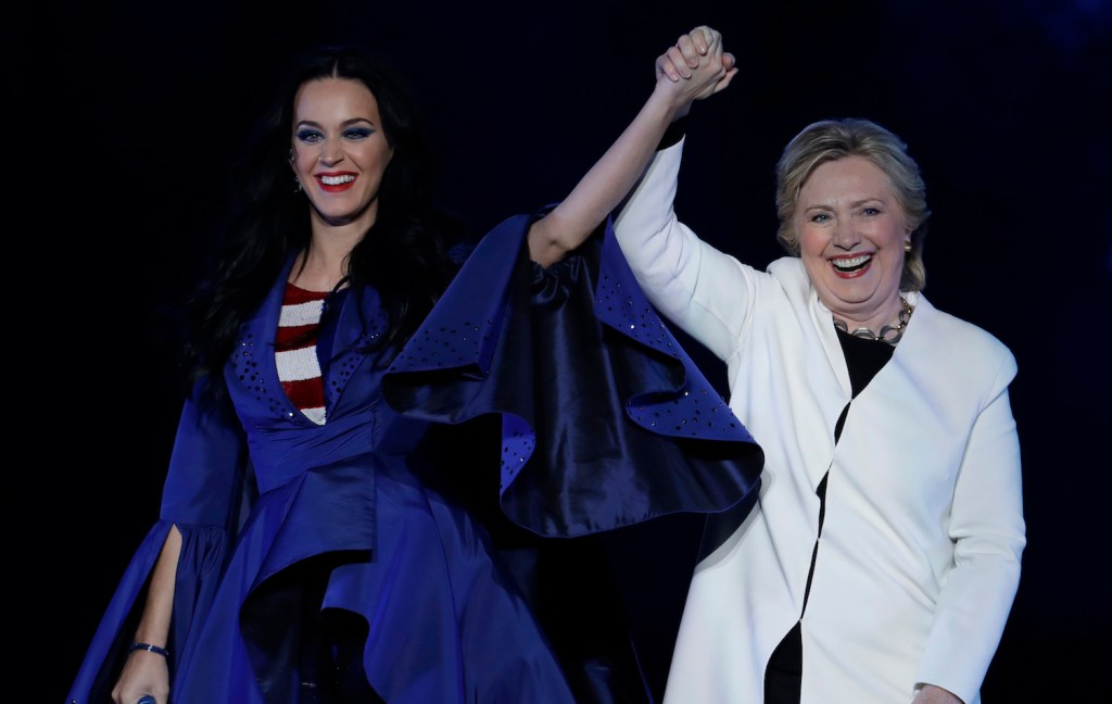 Hillary Clinton models shoes designed by Katy Perry