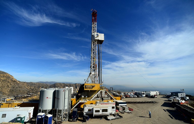 FILE - In this Dec. 9, 2015, file photo, crews work on stopping a gas leak at a relief well at the Aliso Canyon facility above the Porter Ranch area of Los Angeles. (Dean Musgrove/Los Angeles Daily News via AP, Pool, File)