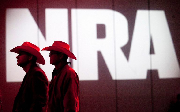 NRA members listen to speakers during the NRA Annual Meeting of Members at the National Rifle Association's 142 Annual Meetings and Exhibits in the George R. Brown Convention Center Saturday, May 4, 2013, in Houston.