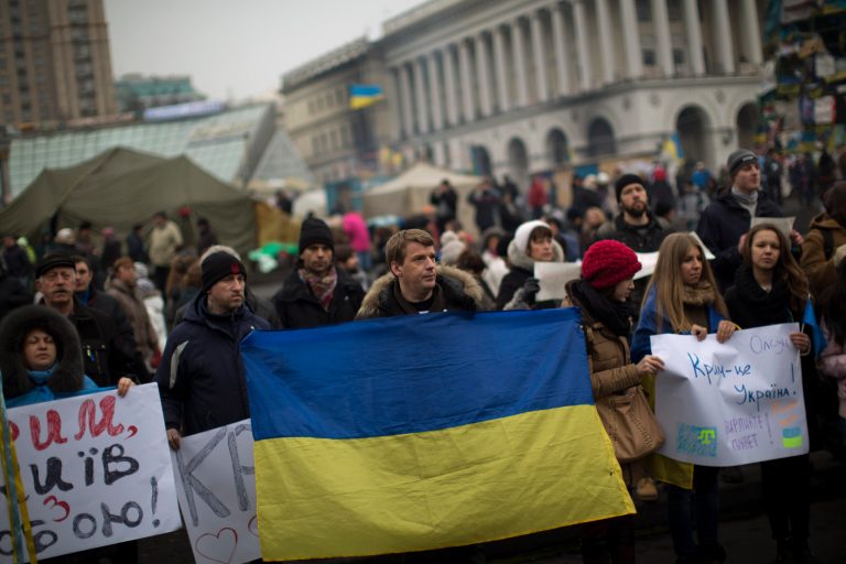 Protesters demonstrate against the military intervention of Russia in Crimea, as they gather in Kiev's Independence Square in Ukraine on Saturday. (AP Photo/Emilio Morenatti)