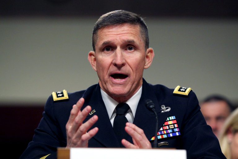 FILE - In this Feb. 11, 2014, file photo, Defense Intelligence Agency Director Lt. Gen. Michael Flynn testifies on Capitol Hill in Washington. Flynn, the three-star Army general who has headed the Defense Intelligence Agency for less than two years is being nudged aside amid conflict within the agency and between the general and leaders elsewhere in the intelligence community, a senior defense official said Wednesday, April 30. (AP Photo/Lauren Victoria Burke, File)