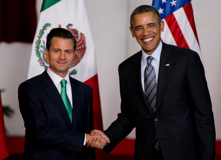 Mexico's President Enrique Pena Nieto, left, and President Obama pose for photographers at the North American Leaders Summit in Toluca, Mexico, February 2014. (AP Photo/Eduardo Verdugo)