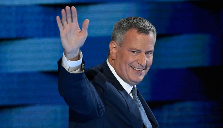 Bill de Blasio, mayor of New York City, waves while exiting the stage during the Democratic National Convention in Philadelphia on Wednesday, July 27, 2016.