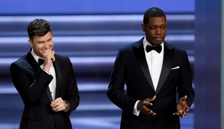 Hosts Colin Jost and Michael Che speak at the 70th Primetime Emmy Awards on Sept. 17, 2018, at the Microsoft Theater in Los Angeles.