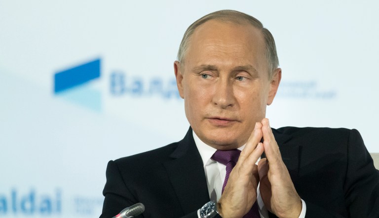 Russian President Vladimir Putin gestures while speaking at the plenary session of the an annual meeting of the Valdai International Discussion Club in the Black Sea resort of Sochi, Russia, Thursday, Oct. 19, 2017.