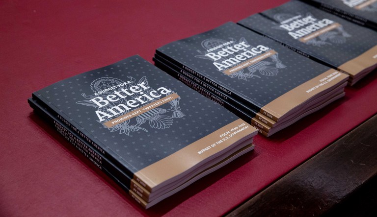 Copies of U.S. President Donald Trump's fiscal year 2020 budget request are displayed in the House Budget Committee hearing room on Capitol Hill in Washington, D.C., U.S., on Monday, March 11, 2019.