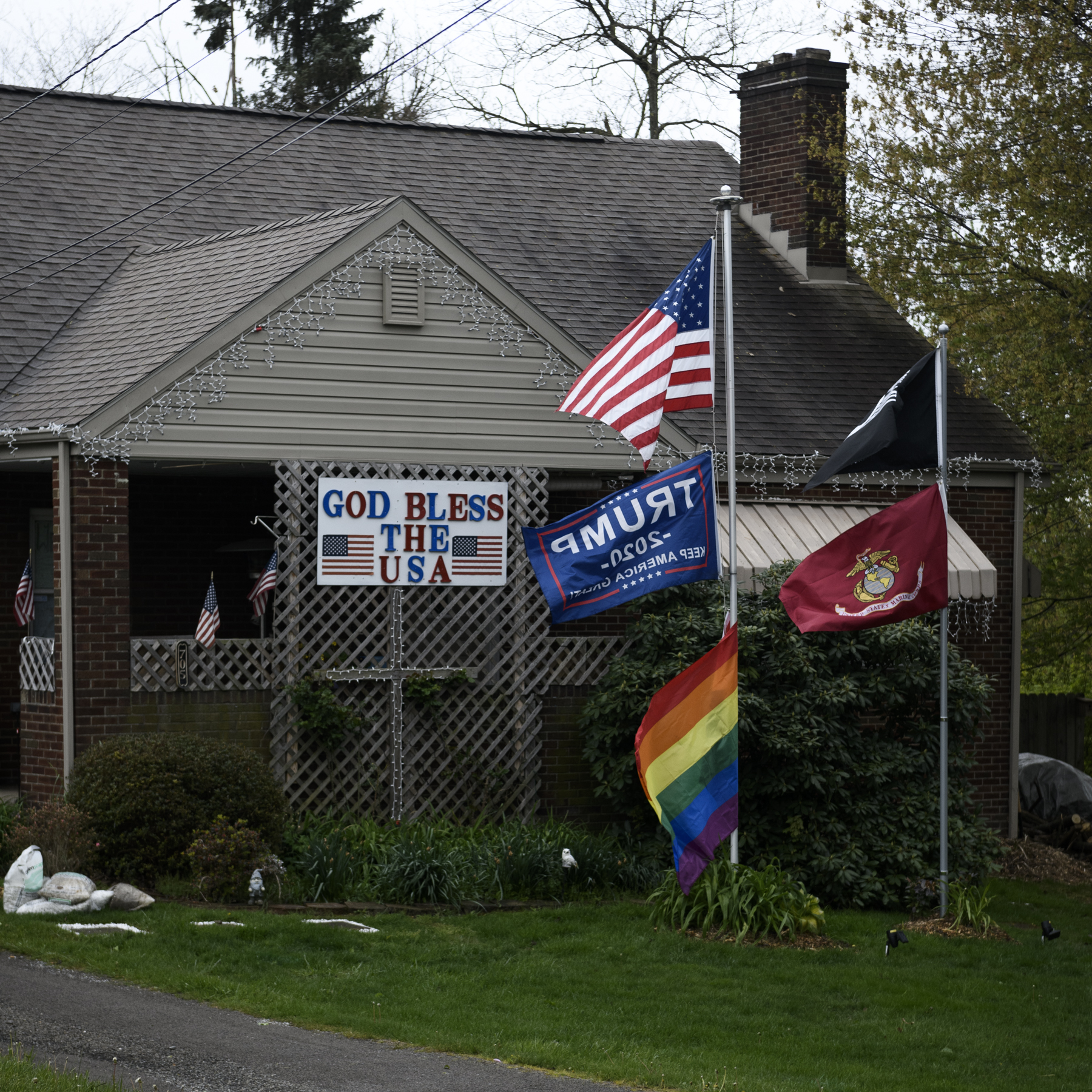 A display of flags is seen in a front yard in Beaver County on Monday.