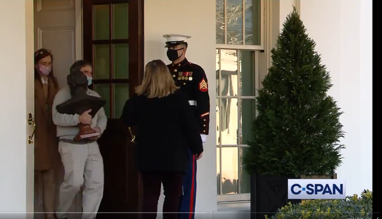 A bust of Lincoln is removed from the White House West Wing.