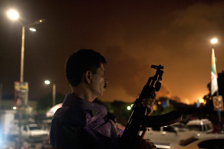 A Pakistani soldier takes position at Jinnah International Airport  where security forces are fighting with gunmen who disguised themselves as police guards and stormed a terminal used for VIPs and cargo, Sunday night, June 8, 2014, in Pakistan. The airport attack still was ongoing early Monday in Karachi, a sprawling port city on the southern coast of Pakistan, although officials said all the passengers had been evacuated.  (AP Photo/Shakil Adil)