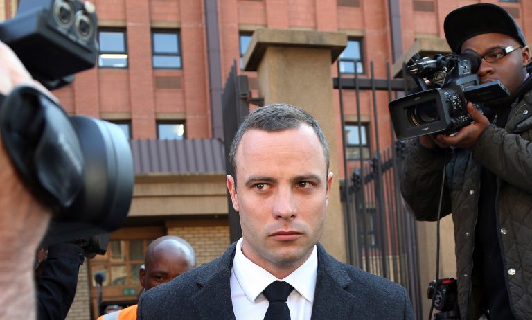 Oscar Pistorius leaves the high court in Pretoria, South Africa, Tuesday, May 20, 2014. Pistorius is charged with murder for the shooting death of his girlfriend, Reeva Steenkamp, on Valentines Day in 2013. (AP Photo/Themba Hadebe)