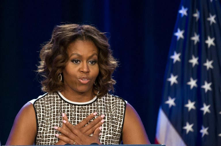 First lady Michelle Obama speaks at the 2014 National Conference on Ending Homelessness, part of the Joining Forces initiative,  Thursday, July 31, 2014,  in Washington. (AP Photo/Cliff Owen)