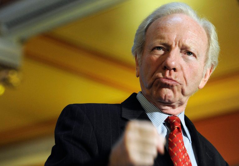 FILE - This Dec. 10, 2012 file photo, then U.S. Sen. Joseph Lieberman, I-Conn. gestures during a news conference at the state capitol in Hartford, Conn. Lieberman, who represented Connecticut in the U.S. Senate between 1989 and 2013, has been appointed a professor at Yeshiva University for the coming school year. (AP Photo/Jessica Hill, File)