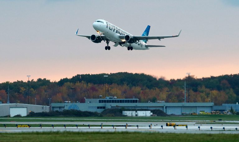 The Frontier Airlines plane that Amber Vinson flew from Cleveland to Dallas on Monday, flies out of Cleveland Hopkins International Airport, Wednesday, Oct. 15, 2014, in Cleveland. Vinson is the second nurse to be diagnosed with Ebola at the Texas Health Presbyterian Hospital in Dallas. The plane on which Vinson flew back to Dallas was decontaminated twice and was to be used for a flight Wednesday that was later canceled. The plane departed Wednesday evening for Denver carrying no passengers, said Jacqueline Mayo, Cleveland airports spokeswoman. (AP Photo/Tony Dejak)