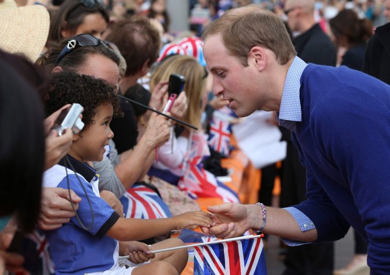 Britain's Prince William meets people as he and his wife, Kate, the Duchess of Cambridge, arrive at Viaduct Basin in Auckland, New Zealand, Friday, April 11, 2014, as they prepare to go sailing. The royal couple, along with their son Prince George, are on an official visit to New Zealand. (AP Photo/Fiona Goodall, Pool)